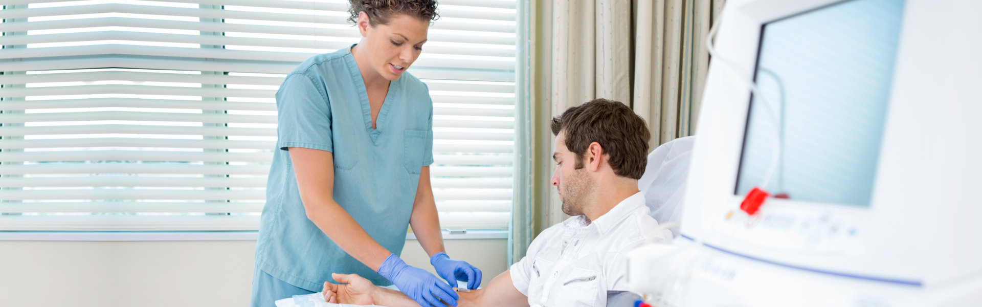 Nurse preparing the arms of the man for injection