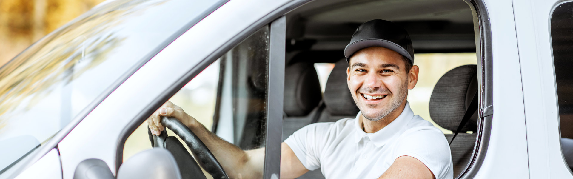 Driver smiling while inside the vehicle